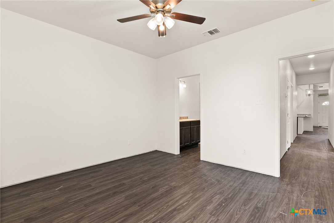 117 Leon Lane Kempner, TX 76539 - Photo 6 of 20 wooden floor in an empty room with a window