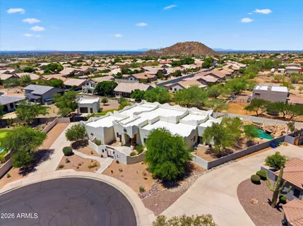 an aerial view of residential houses with outdoor space