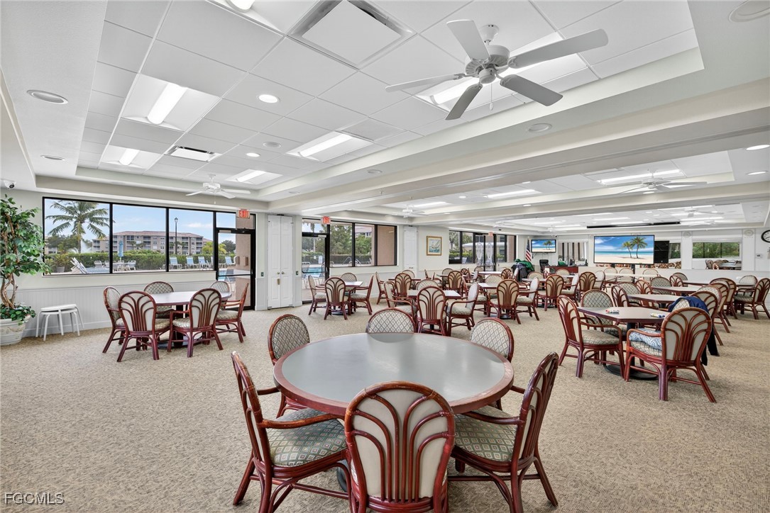 14081 Brant Point Circle, Unit 5403 Fort Myers, FL 33919 - Photo 25 of 41 a dining room with furniture water view and a floor to ceiling window