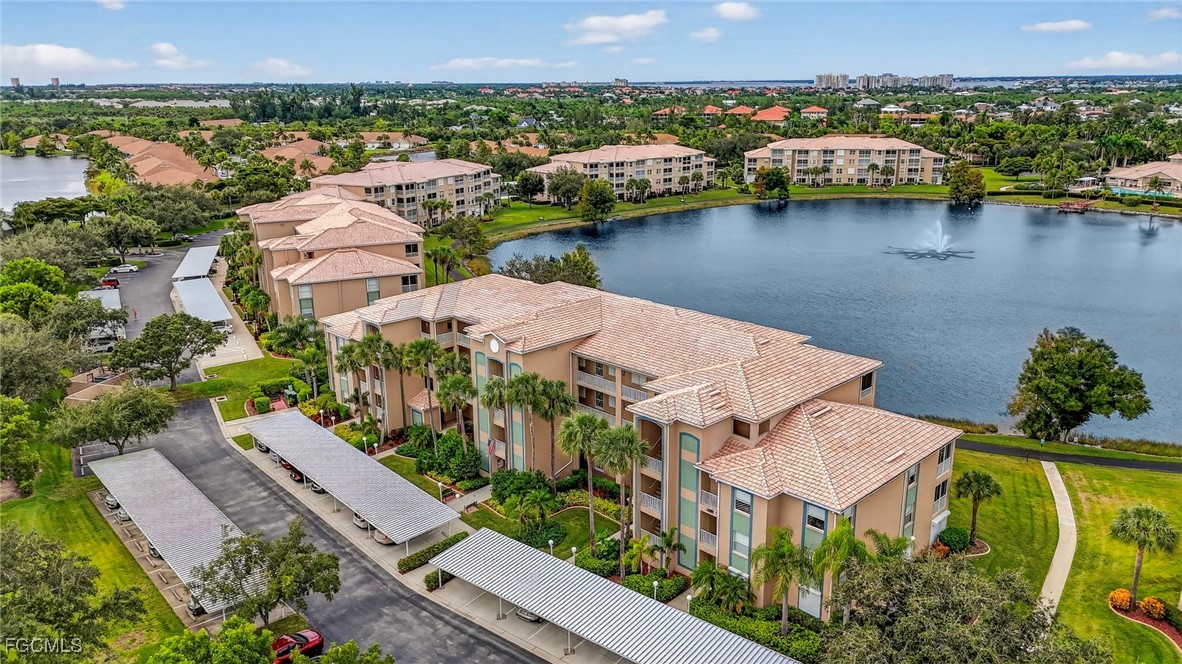 14081 Brant Point Circle, Unit 5403 Fort Myers, FL 33919 - Photo 32 of 41 an aerial view of residential houses with outdoor space and lake view