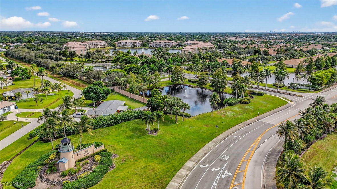 14081 Brant Point Circle, Unit 5403 Fort Myers, FL 33919 - Photo 39 of 41 an aerial view of a house with a yard and lake view