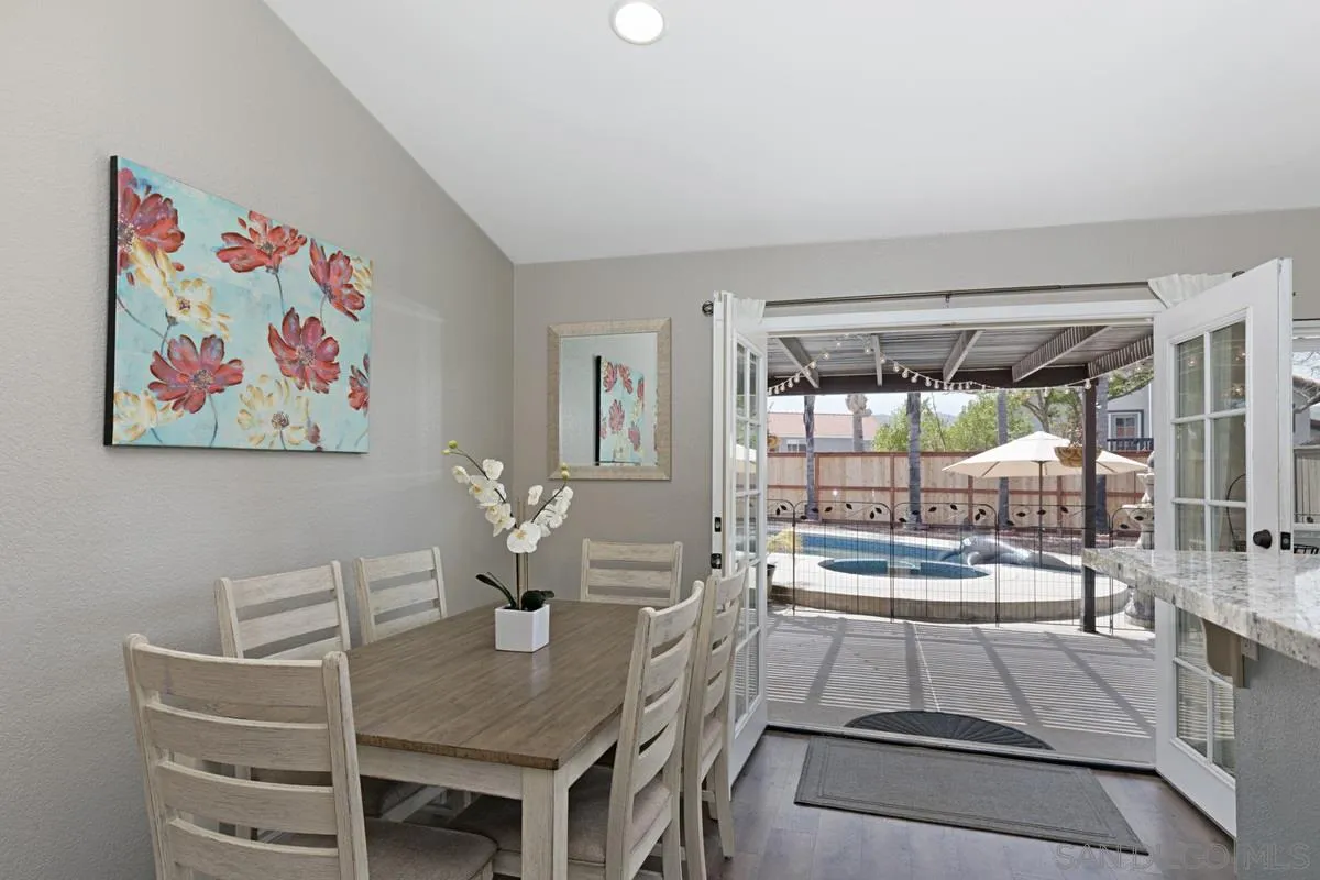 22895 Temet Street Wildomar, CA 92595 - Photo 11 of 36 a dining room with furniture and a large window
