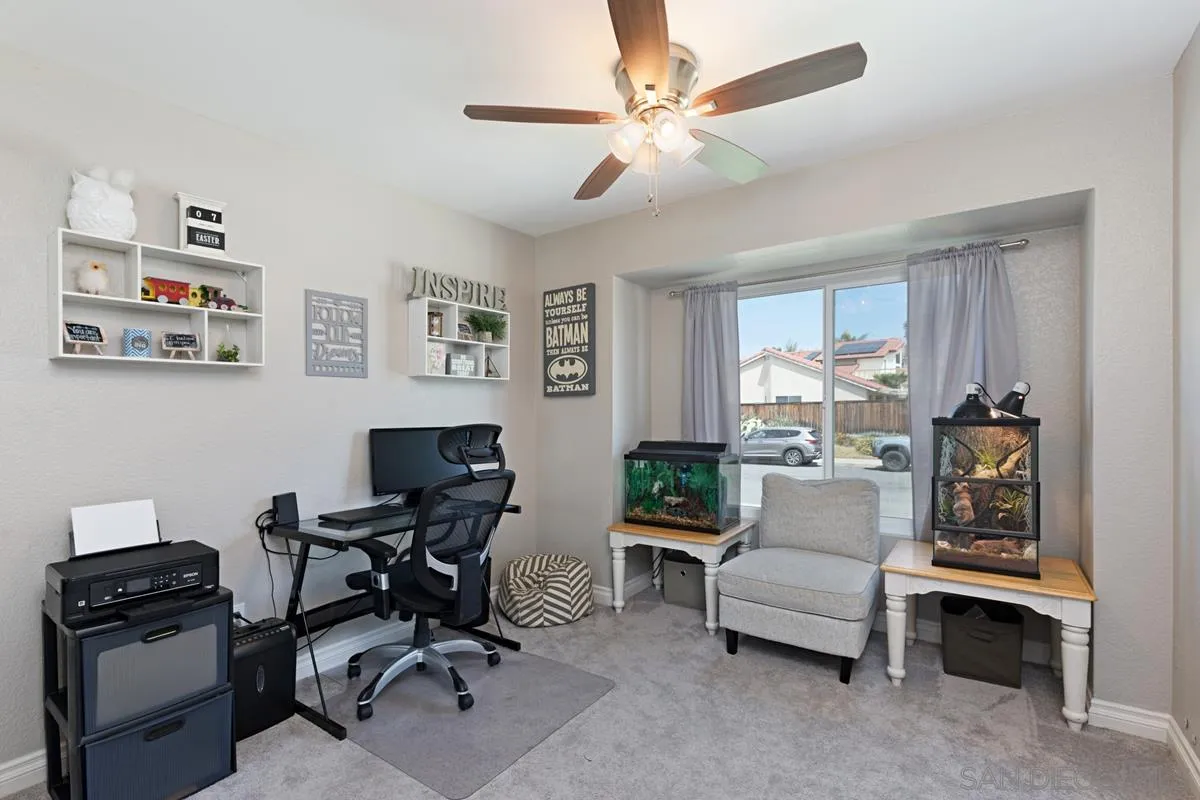 22895 Temet Street Wildomar, CA 92595 - Photo 25 of 36 a view of a workspace with furniture and a window