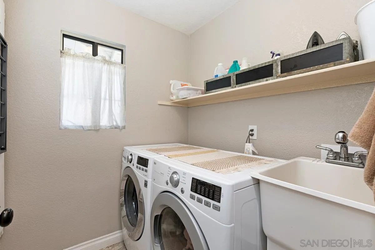 22895 Temet Street Wildomar, CA 92595 - Photo 26 of 36 a utility room with dryer and washer