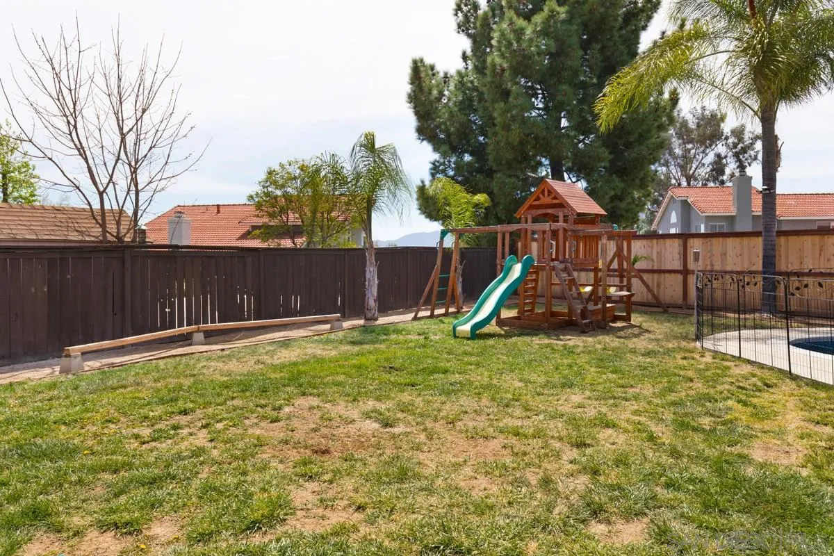 22895 Temet Street Wildomar, CA 92595 - Photo 28 of 36 a view of a backyard with a tree