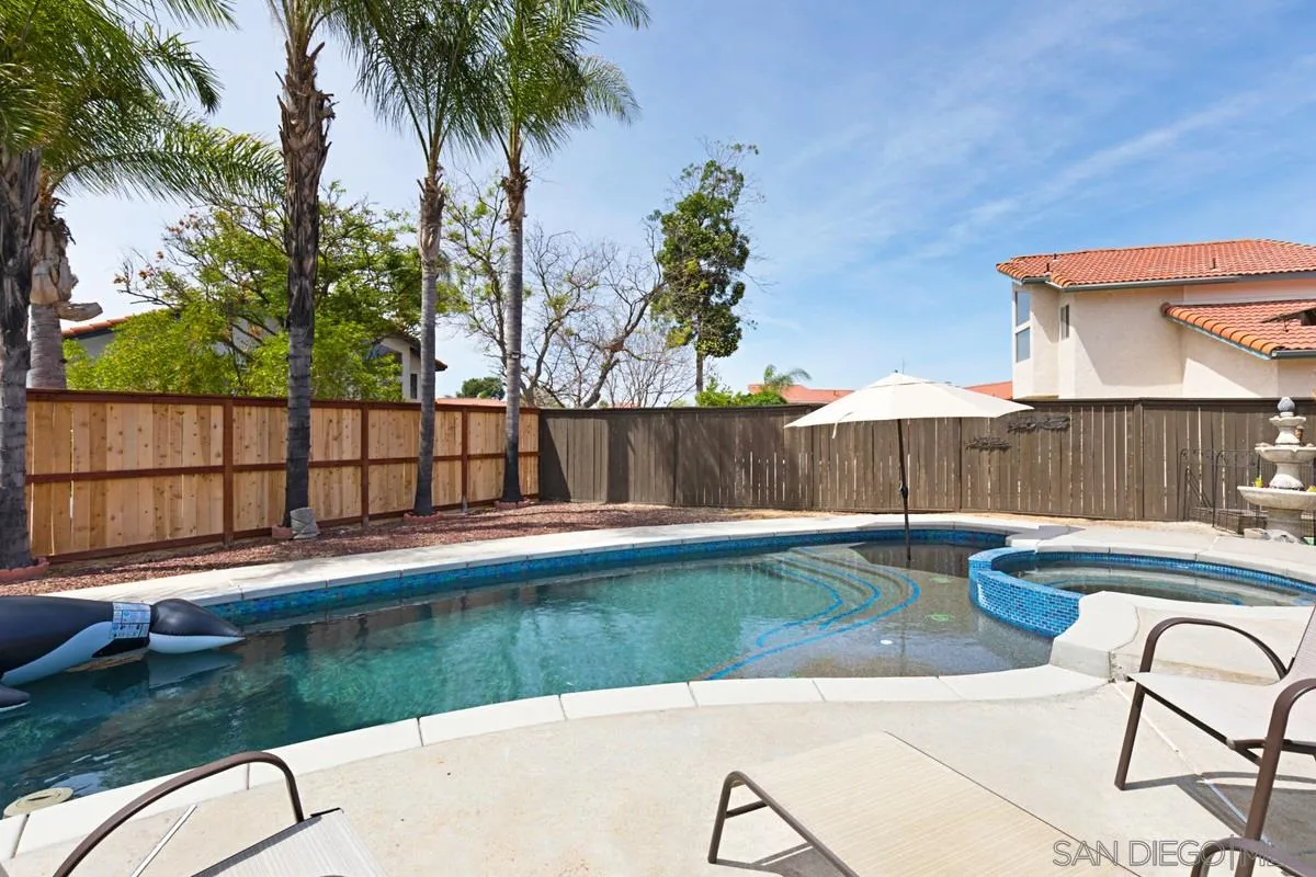 22895 Temet Street Wildomar, CA 92595 - Photo 32 of 36 a view of backyard with swimming pool and outdoor seating