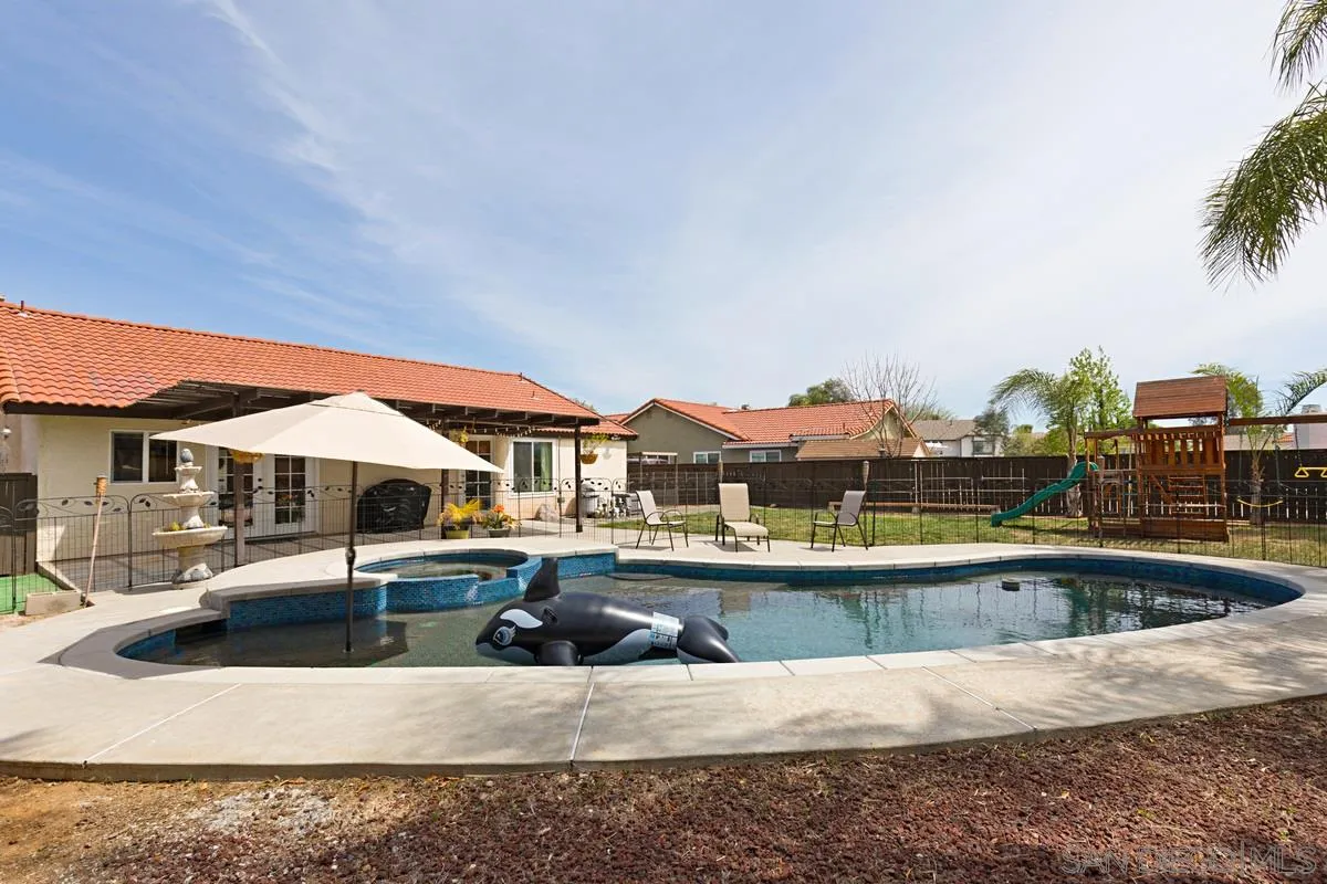 22895 Temet Street Wildomar, CA 92595 - Photo 35 of 36 a view of a swimming pool with a patio