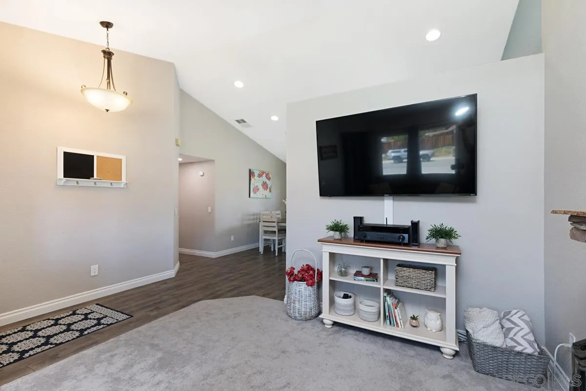 22895 Temet Street Wildomar, CA 92595 - Photo 9 of 36 a room with furniture and flat screen tv