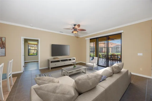 a view of a patio with a table chairs and backyard