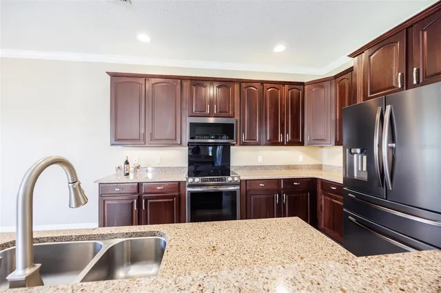 a bedroom with a bed couch and window
