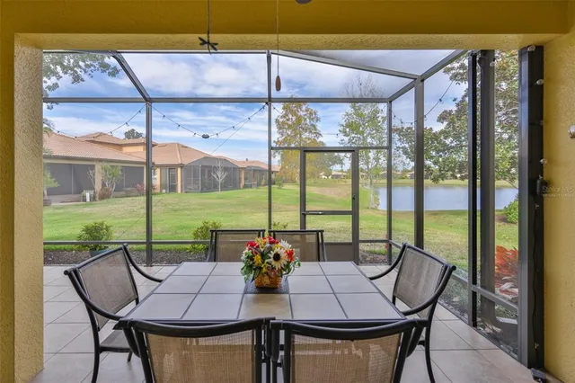 a view of an empty room window and wooden floor