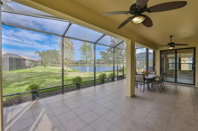 a bedroom with a large bed and wooden floor