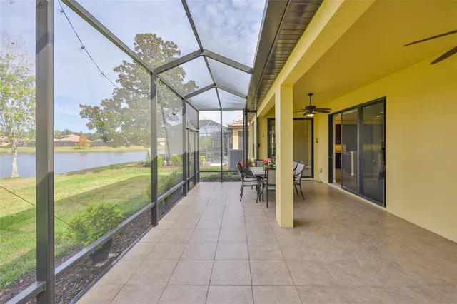 a front view of a house with a garden and yard