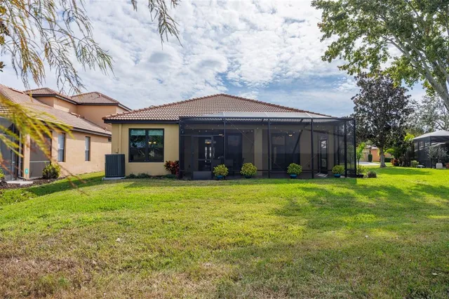 an aerial view of residential houses with outdoor space and river