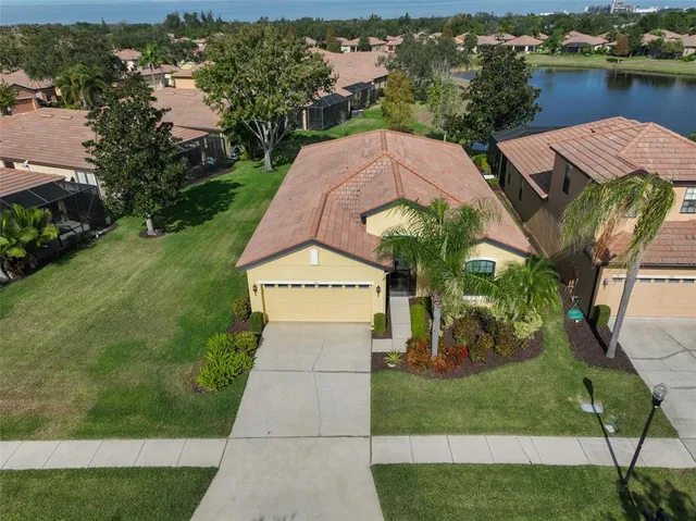 a view of a livingroom with a hardwood floor and a ceiling fan