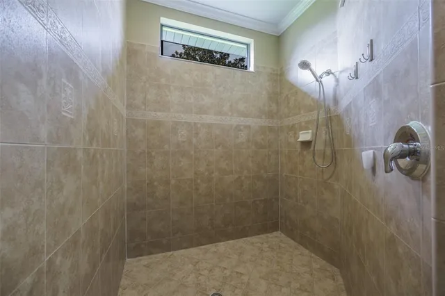 a front view of house with yard and swimming pool