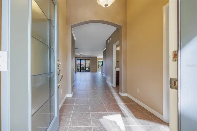 a kitchen with stainless steel appliances kitchen island granite countertop a stove a sink and a refrigerator