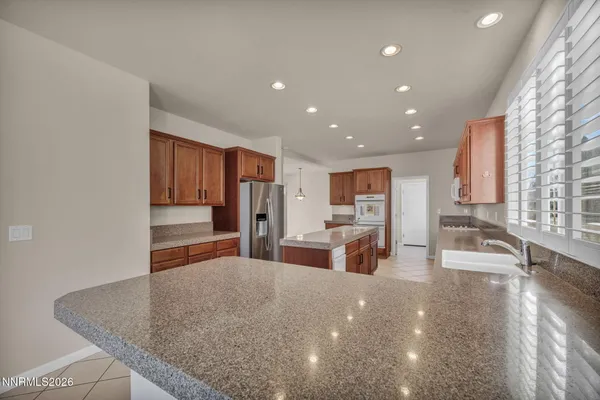 an empty room with a window and a ceiling fan
