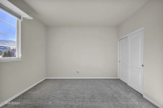 a room with furniture and a flat screen tv