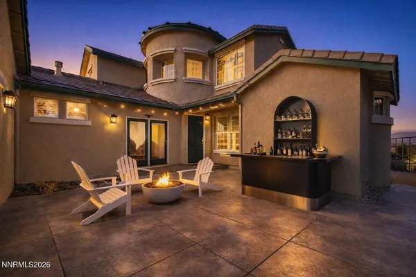 a kitchen with stainless steel appliances granite countertop a sink and a refrigerator