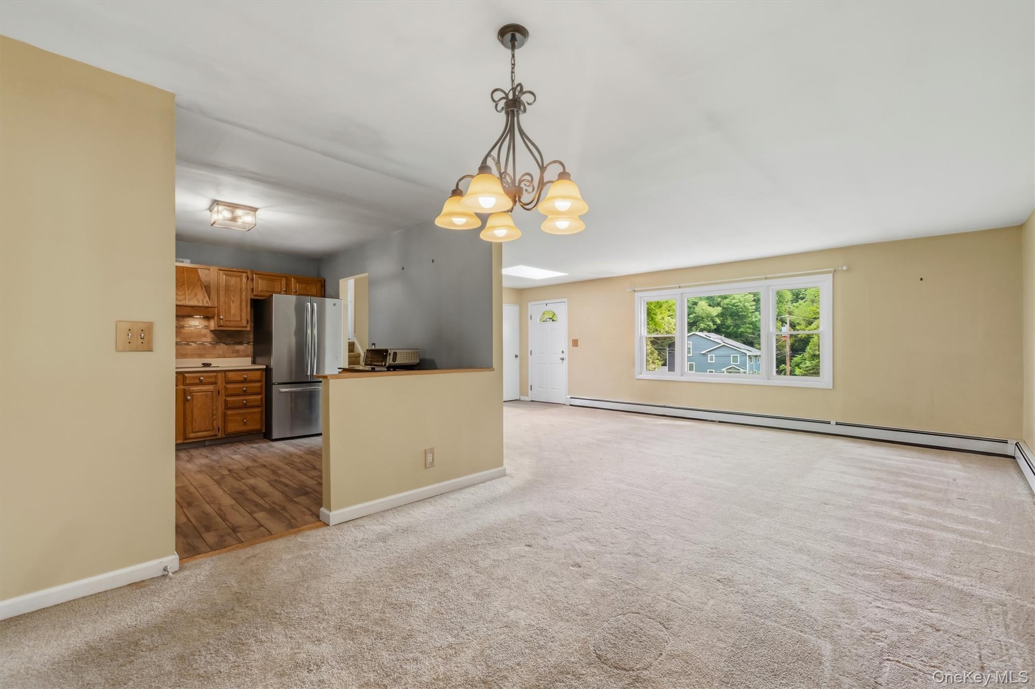 17 Ridge Road Cortlandt Manor, NY 10567 - Photo 8 of 38 View of dining area to living room w/open kitchen