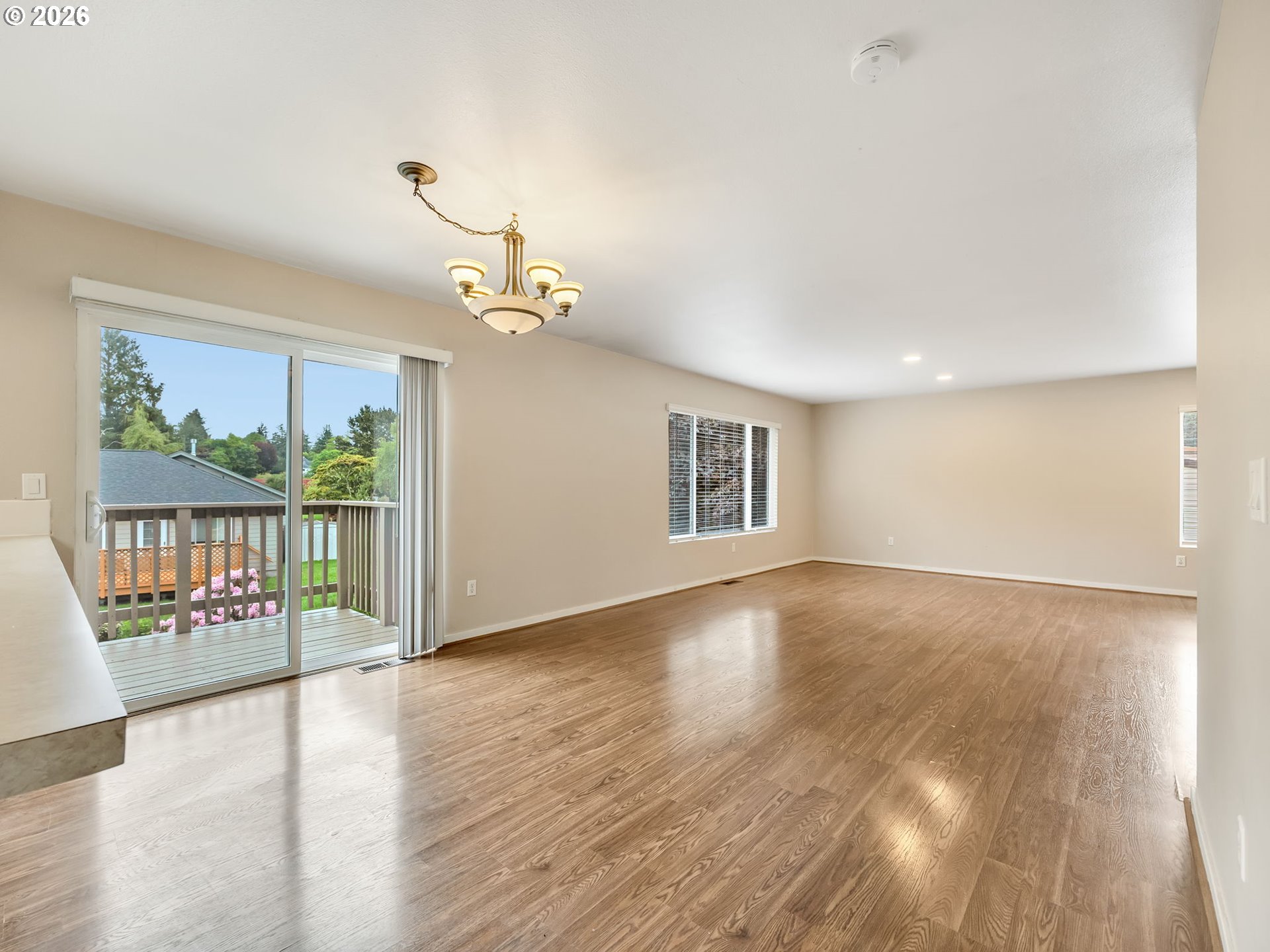 91923 Ridge Road Warrenton, OR 97146 - Photo 8 of 35 a view of an empty room with wooden floor and a window
