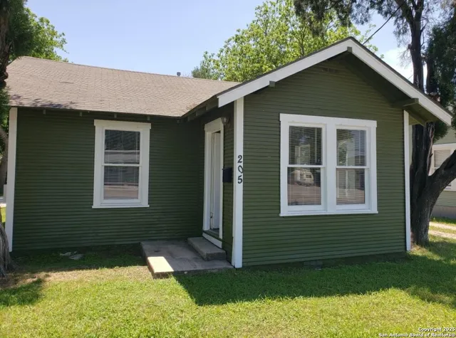 a view of a backyard of the house