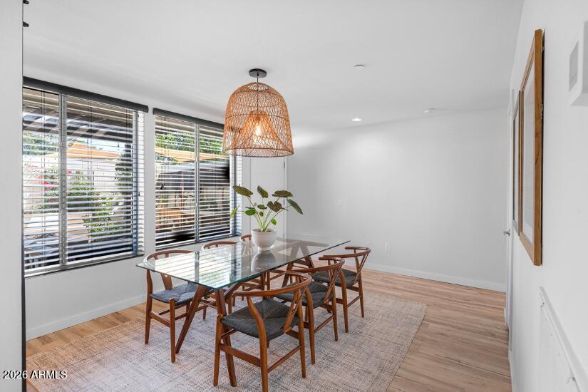 2929 North 39th Street, Unit 2 Phoenix, AZ 85018 - Photo 12 of 26 a view of a dining room with furniture and wooden floor