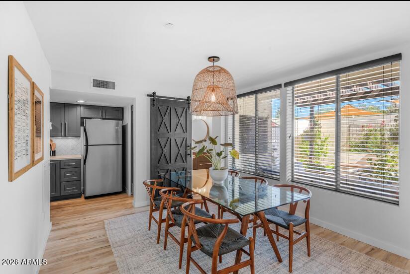 2929 North 39th Street, Unit 2 Phoenix, AZ 85018 - Photo 13 of 26 a dining room with furniture and window