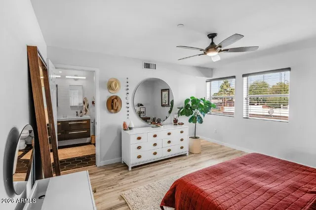 a bedroom with furniture and a window