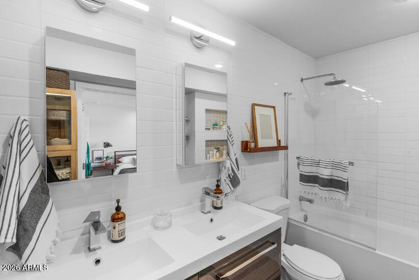 2929 North 39th Street, Unit 2 Phoenix, AZ 85018 - Photo 18 of 26 a bathroom with a sink toilet and mirror