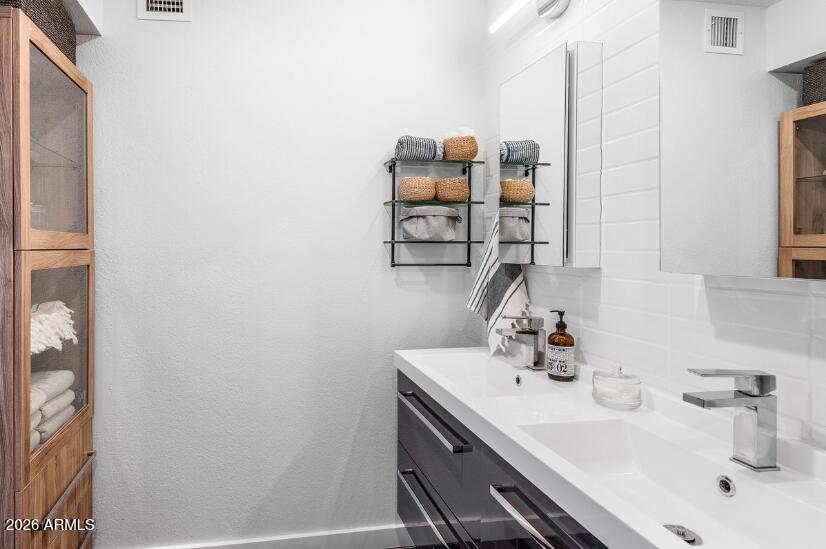 2929 North 39th Street, Unit 2 Phoenix, AZ 85018 - Photo 19 of 26 a bathroom with a sink and a mirror