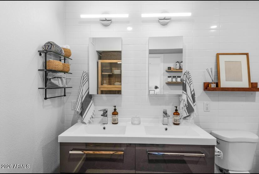 2929 North 39th Street, Unit 2 Phoenix, AZ 85018 - Photo 20 of 26 a bathroom with a sink and a mirror