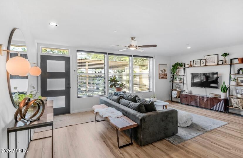 2929 North 39th Street, Unit 2 Phoenix, AZ 85018 - Photo 2 of 26 a living room with furniture a flat screen tv and a large window