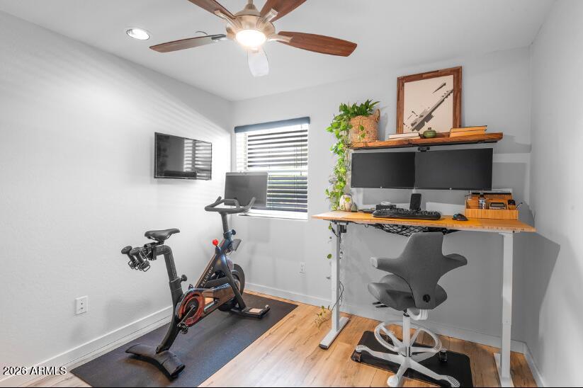 2929 North 39th Street, Unit 2 Phoenix, AZ 85018 - Photo 23 of 26 a view of workspace with wooden floor windows gym equipment and view