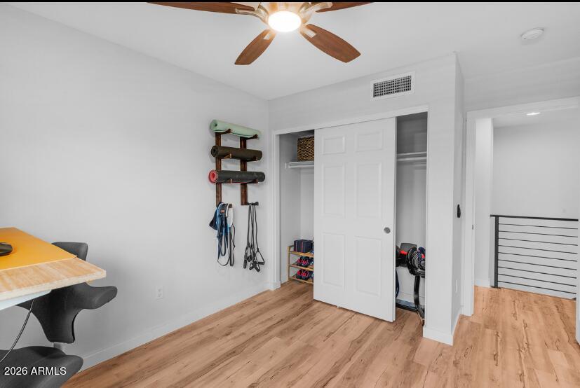 2929 North 39th Street, Unit 2 Phoenix, AZ 85018 - Photo 24 of 26 a view of a hallway with wooden floor and closet