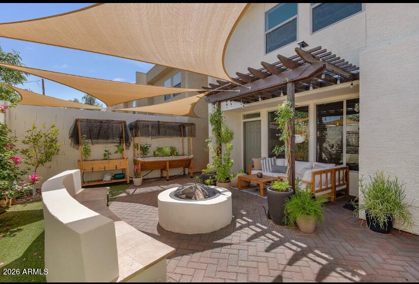 2929 North 39th Street, Unit 2 Phoenix, AZ 85018 - Photo 6 of 26 a view of a patio with table and chairs potted plants and floor to ceiling window and potted plants