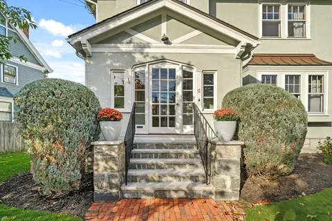 a front view of a house with a porch
