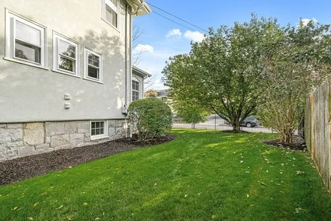 a view of backyard of a house