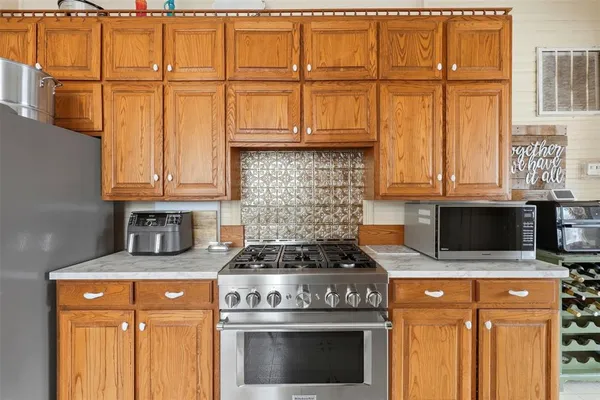 a view of a dining room with furniture and a chandelier