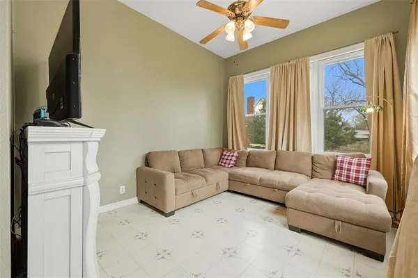 a bedroom with a bed and a television