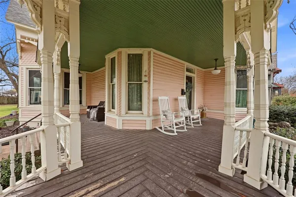 a front view of a house with outdoor seating