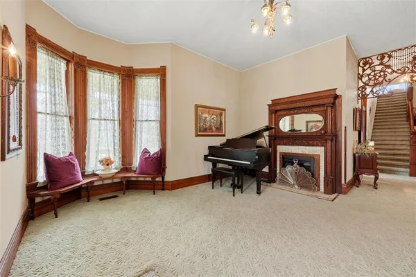 a living room with furniture and a chandelier