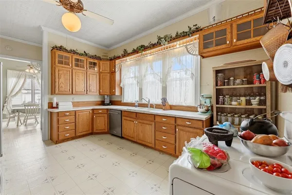 a kitchen with a sink stove and cabinets