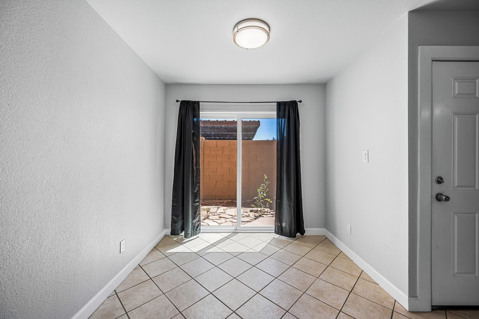1455 North Alma School Road, Unit 11 Mesa, AZ 85201 - Photo 13 of 17 an empty room with window
