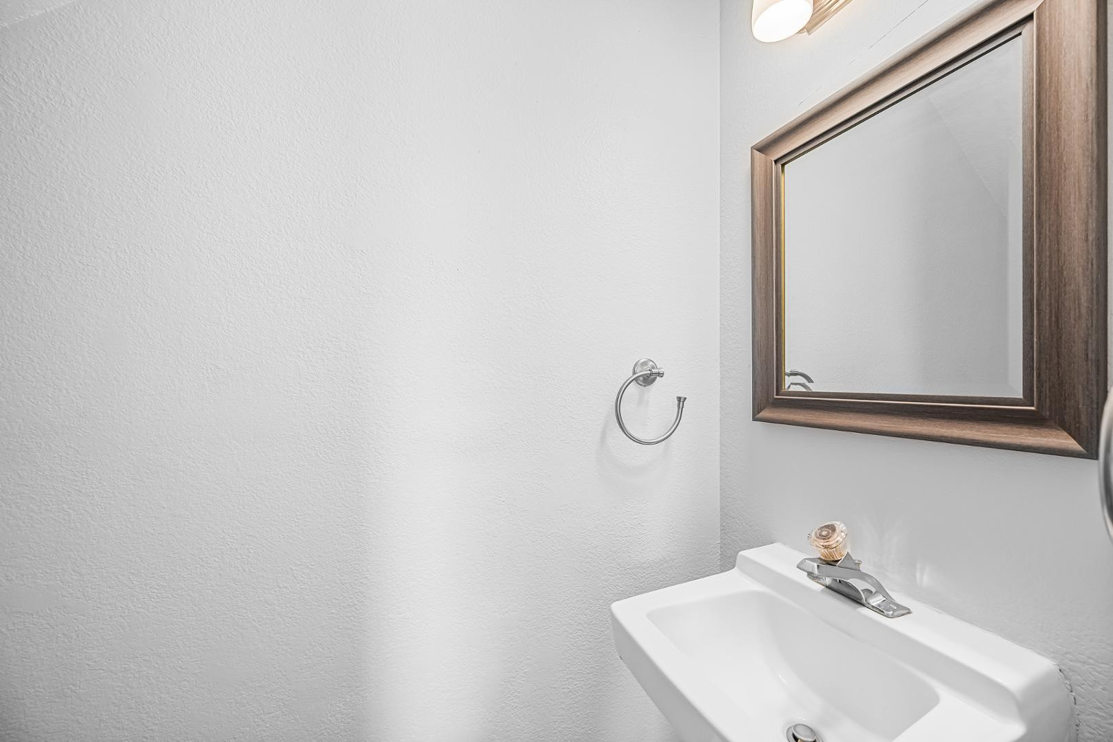 1455 North Alma School Road, Unit 11 Mesa, AZ 85201 - Photo 10 of 17 a bathroom with a sink and a mirror