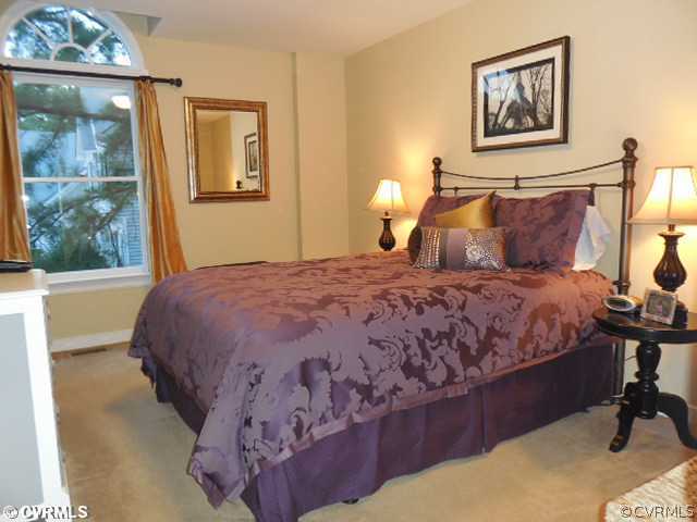 13904 Sagebrook Road Midlothian, VA 23112 - Photo 16 of 19 a large bed sitting in a bedroom next to a window