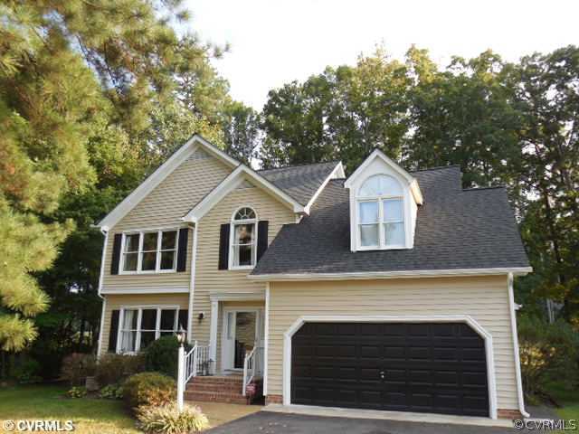 13904 Sagebrook Road Midlothian, VA 23112 - Photo 18 of 19 a front view of a house with a yard