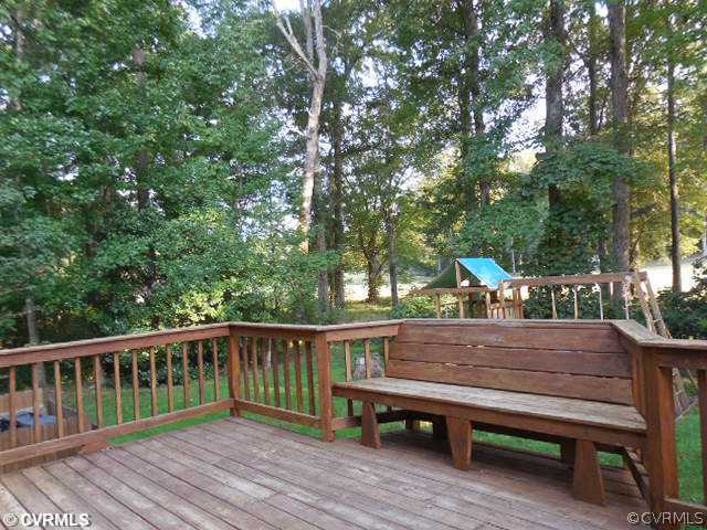 13904 Sagebrook Road Midlothian, VA 23112 - Photo 3 of 19 a view of backyard with wooden deck and seating
