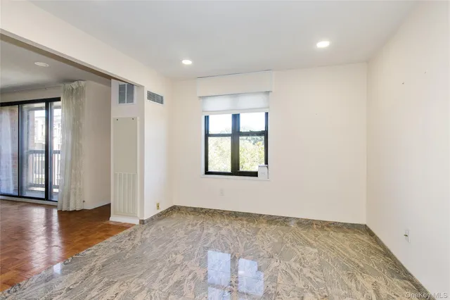 a bathroom with a sink mirror vanity and toilet
